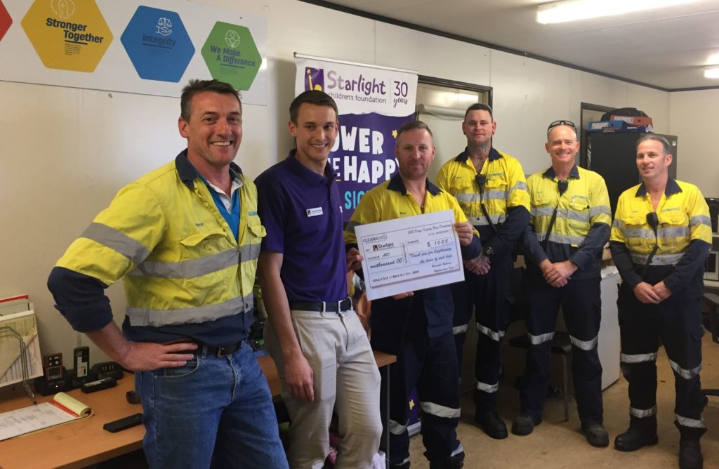 The Hydrocarbons operations team presenting the cheque to Jerome